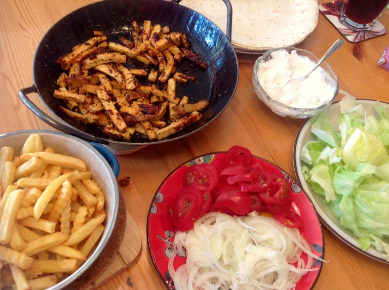 Tofu wraps, vegan tsatsiki, salad and potato fries