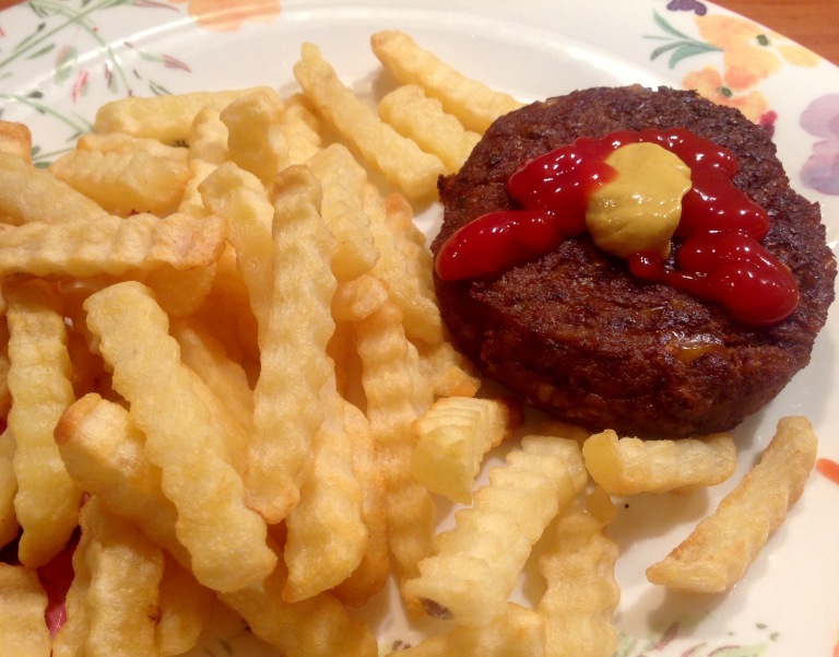Vegan burger with potato fries