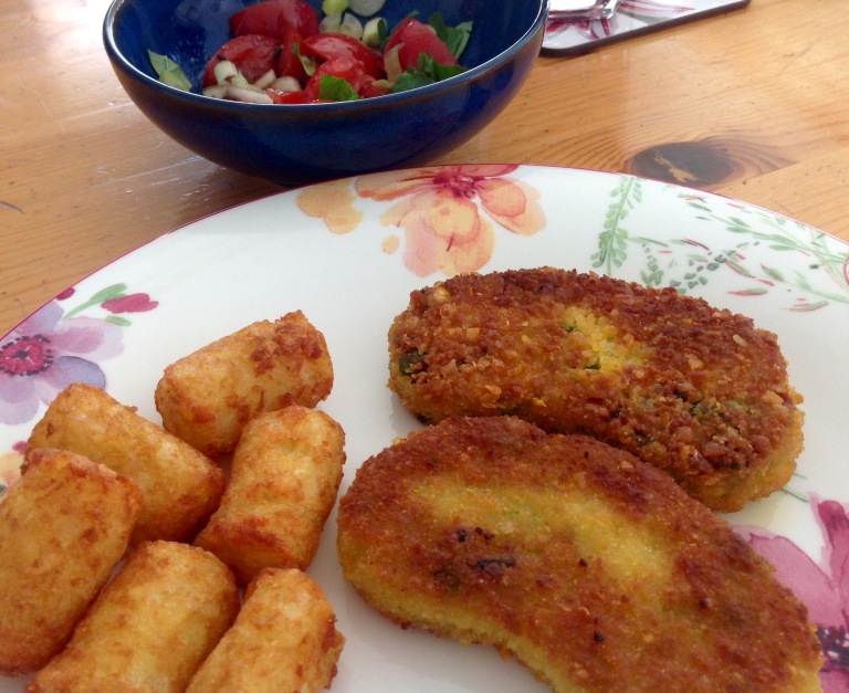 Vegetable cutlets, potato croquettes and tomato salad