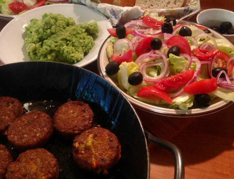 Vegan mini burgers, guacamole, Greek salad and bread
