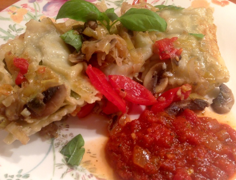 Vegan ravioli with mushrooms, garlic and tomato sauce