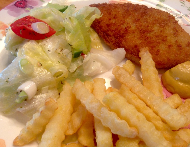 Vegan schnitzel, potato fries and salad