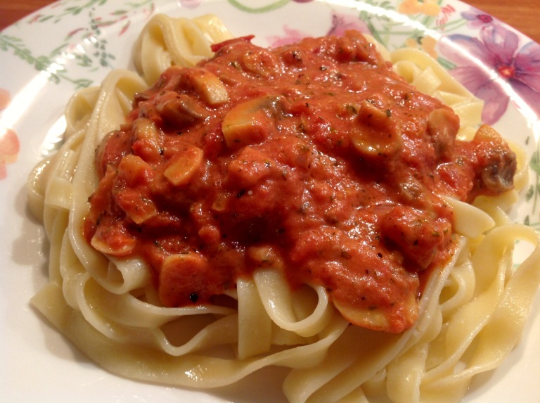 Tagliatelle with tomato and mushroom sauce