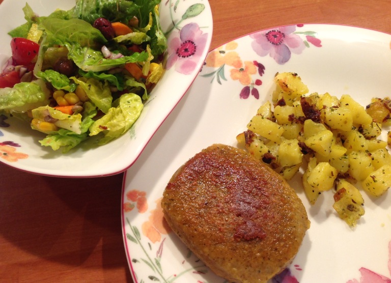 Lupin patty, roast potatoes and mixed salad