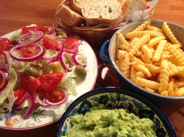 Greek salad, guacamole and potato fries