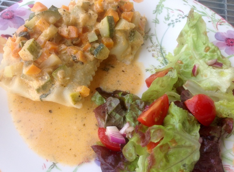 Spinach and herb ravioli with vegetable sauce